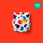 “Poo and pebbles diseno” el pañal ecológico, divertido y colorido para bebé con fondo rojo