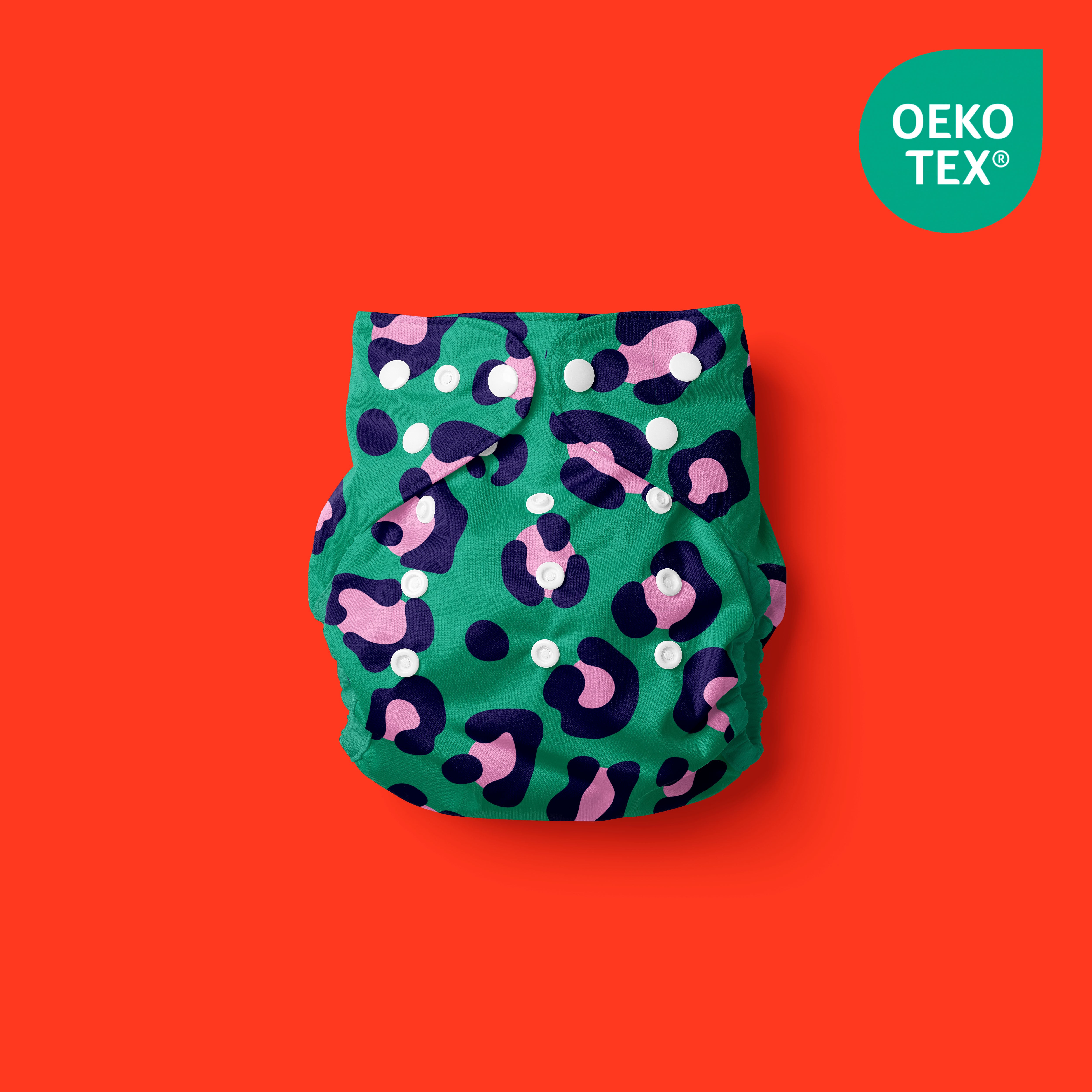 Pañal reutilizable Fiera de mi Poo - un pañal de tela ecológico de color verde con motivos divertidos para bebé - con fondo rojo