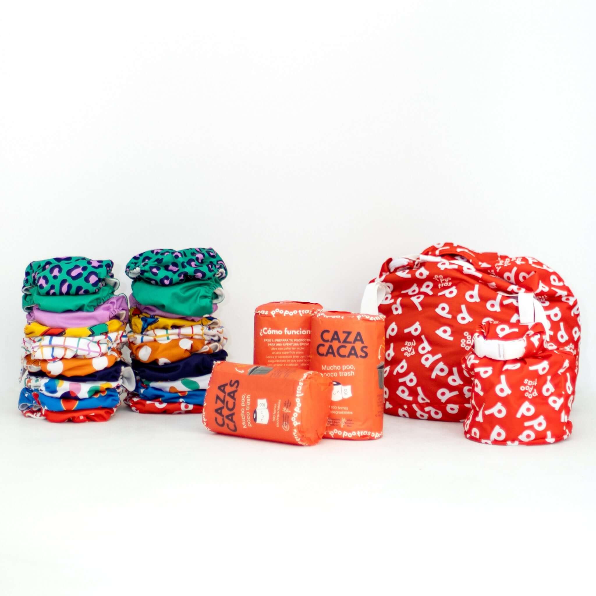 Pack de pañales de tela todo en uno - Poo Master Pack & Commander Pack: un set completo con los pañales de telas, las bolsas y las Caza cacas - en fondo blanco